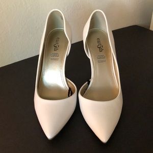 Woman’s white high heel pumps